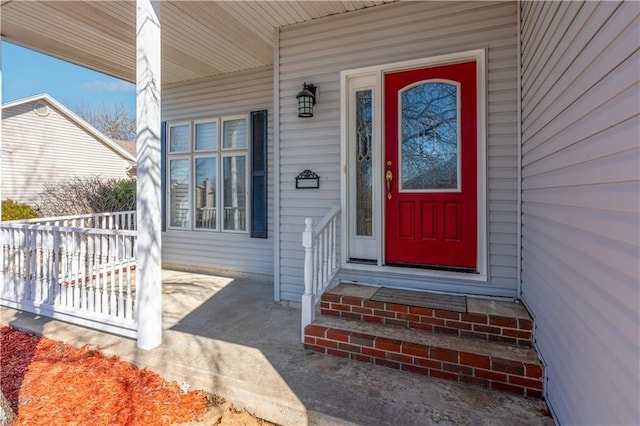 property entrance featuring covered porch