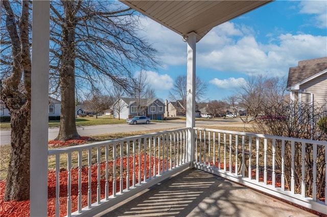 balcony featuring a porch and a residential view