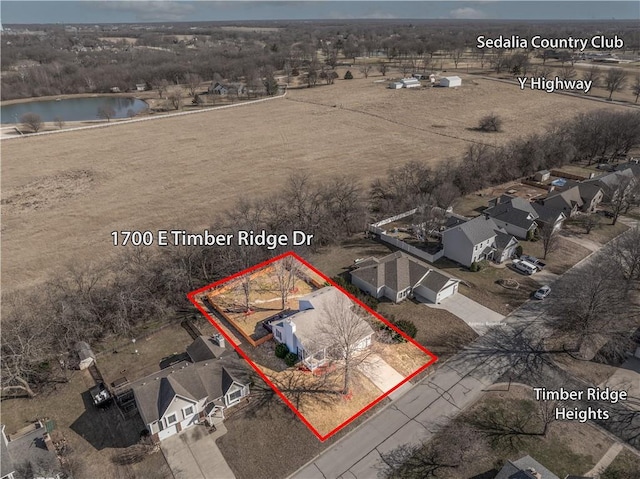 birds eye view of property featuring a water view