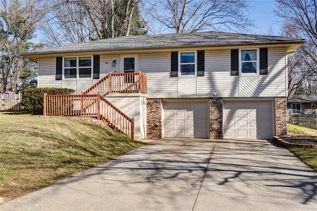 view of front of house featuring brick siding, stairs, a front yard, a garage, and driveway