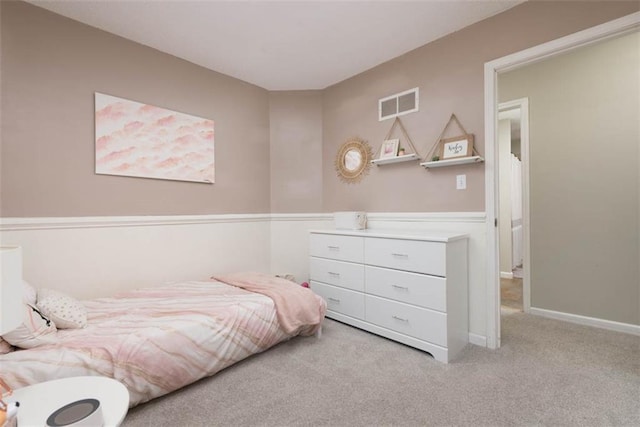 bedroom featuring visible vents, carpet floors, and baseboards