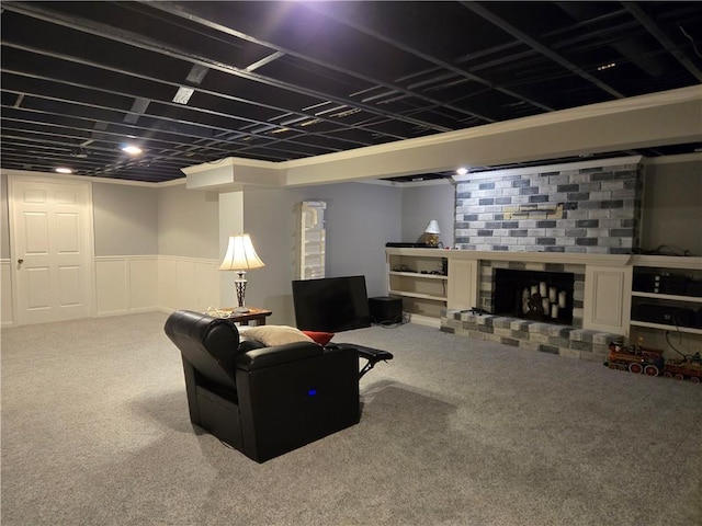 living room featuring a fireplace and carpet floors