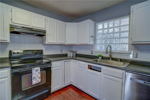 kitchen featuring dark countertops, black range with electric stovetop, under cabinet range hood, dishwasher, and a sink