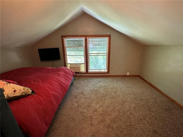 carpeted bedroom featuring cooling unit, baseboards, and vaulted ceiling