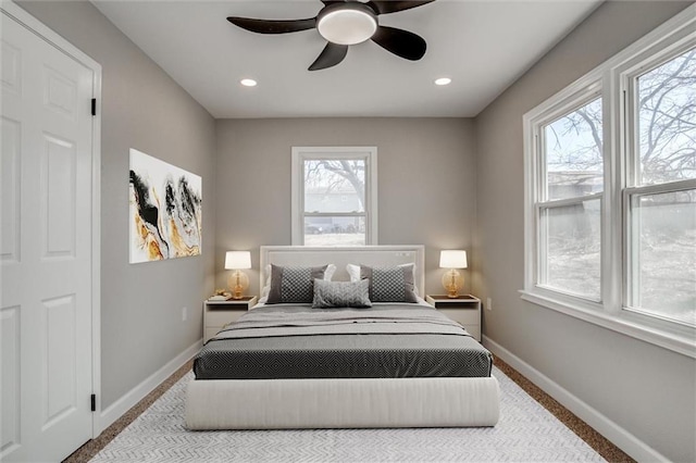 bedroom featuring a ceiling fan, recessed lighting, baseboards, and carpet floors