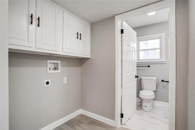 clothes washing area with hookup for a washing machine, baseboards, cabinet space, electric dryer hookup, and marble finish floor