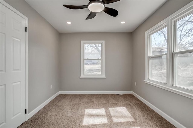 carpeted spare room with recessed lighting, baseboards, and ceiling fan