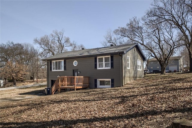 back of house featuring a deck