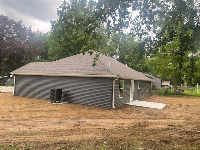 2101 N 31st Ter, Saint Joseph, MO 64506 - view of property exterior featuring roof with shingles and a patio area