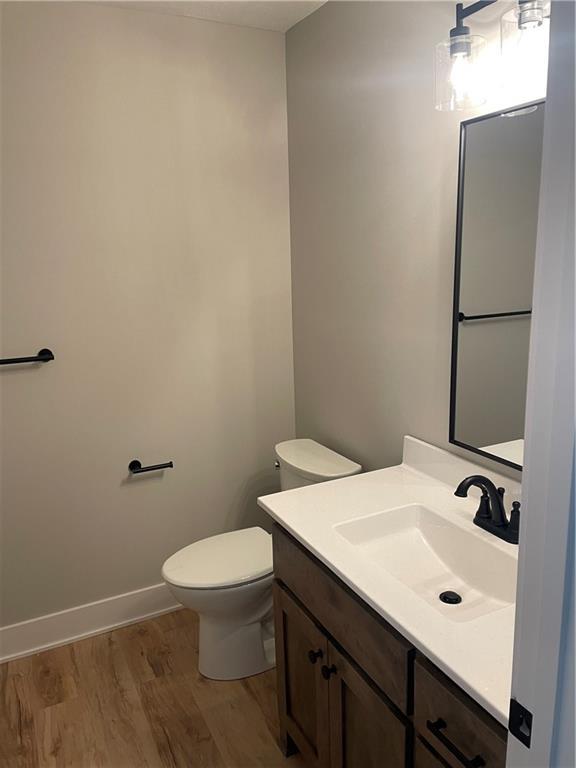 2101 N 31st Ter, Saint Joseph, MO 64506 - bathroom with wood finished floors and vanity