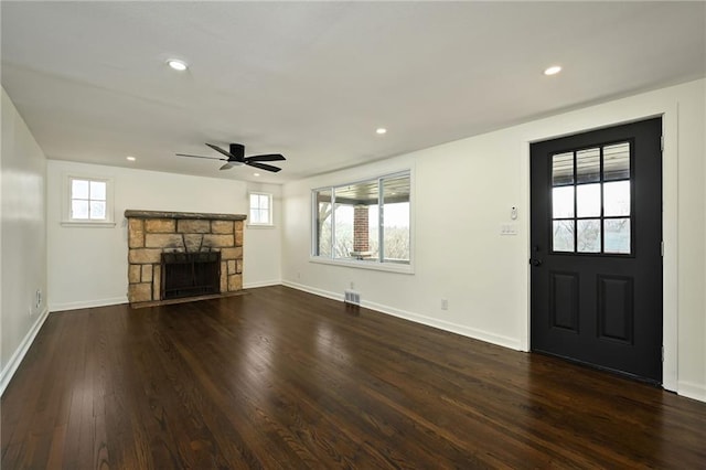 unfurnished living room with recessed lighting, dark wood-type flooring, baseboards, and ceiling fan