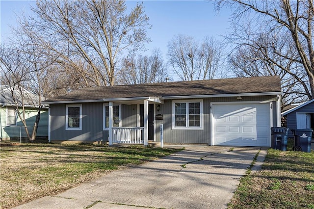 ranch-style home featuring a front yard, an attached garage, covered porch, and driveway