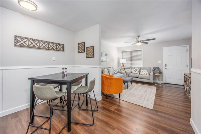 dining room featuring ceiling fan and wood finished floors