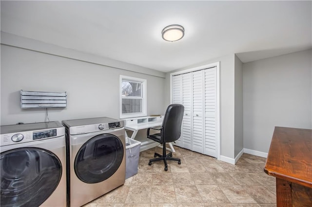 laundry room featuring laundry area, light tile patterned floors, washing machine and dryer, and baseboards