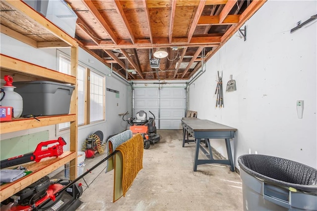 garage featuring a workshop area and a garage door opener