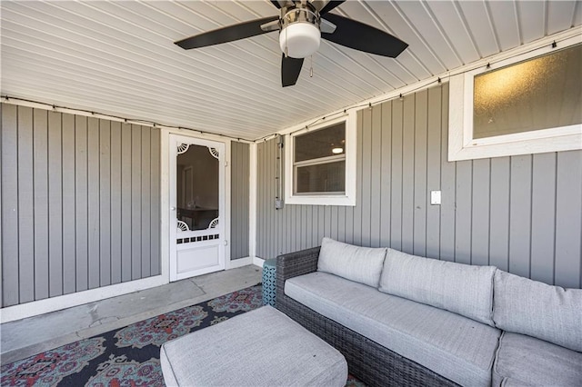 view of patio with an outdoor living space and ceiling fan