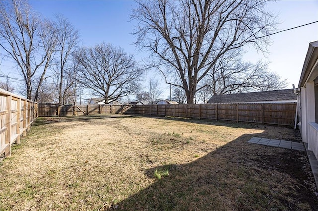 view of yard featuring a fenced backyard