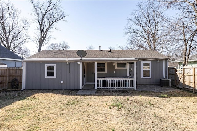 back of house featuring a patio area, a yard, and fence private yard