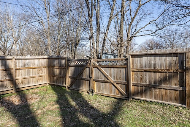 view of yard with fence and a gate