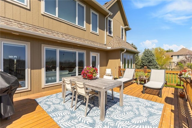 wooden terrace featuring outdoor dining space