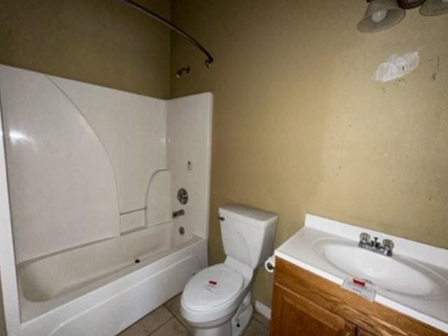 full bath featuring vanity, shower / tub combination, toilet, and tile patterned flooring