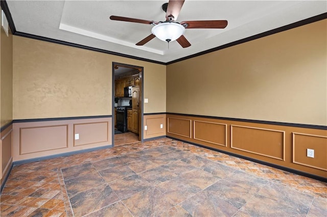 unfurnished room featuring stone finish floor, crown molding, and ceiling fan