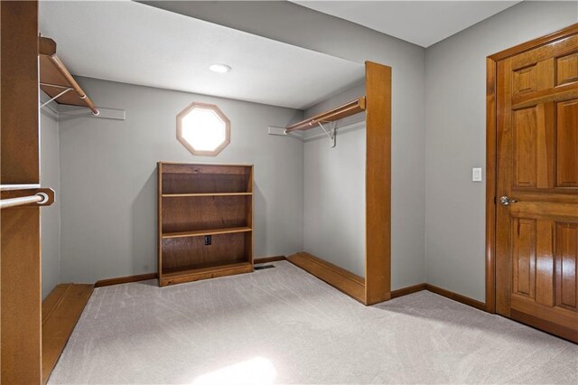 spacious closet featuring carpet