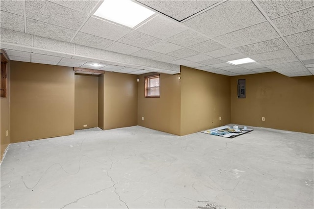 basement with a paneled ceiling