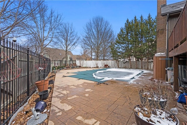 view of swimming pool with a patio area, a fenced in pool, and a fenced backyard