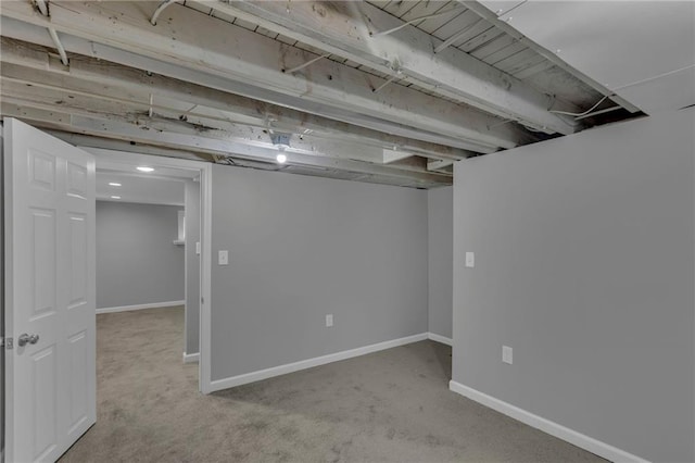 finished basement with carpet flooring and baseboards