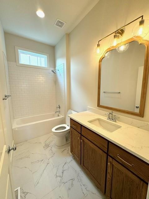 full bathroom featuring visible vents, toilet, shower / bath combination, marble finish floor, and vanity