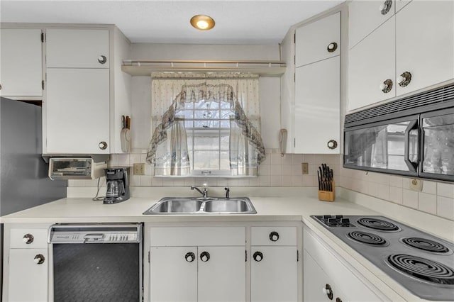 kitchen featuring white cabinetry, black appliances, light countertops, and a sink