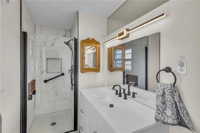 bathroom featuring vanity and a shower stall