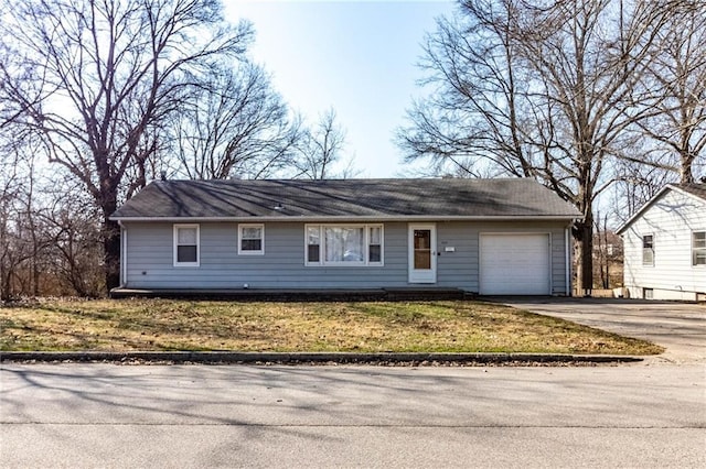 single story home featuring an attached garage and driveway