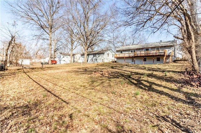 view of yard featuring a wooden deck