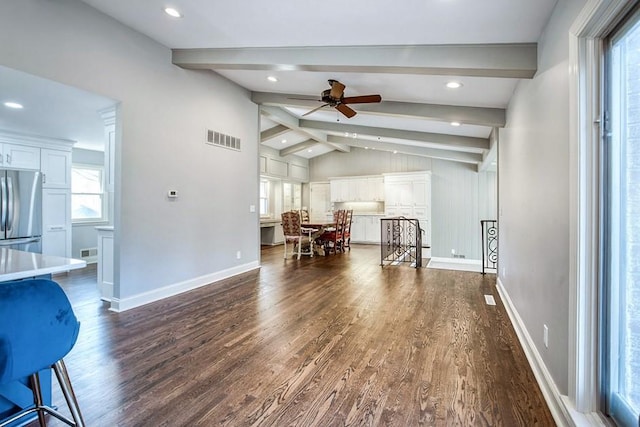 dining room featuring lofted ceiling with beams, visible vents, dark wood-style flooring, and ceiling fan