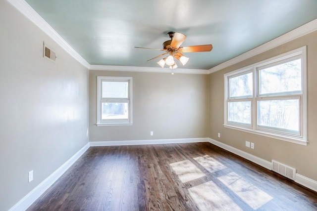 spare room featuring visible vents, baseboards, dark wood-style floors, and ceiling fan