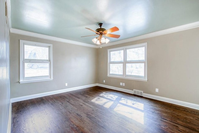 spare room featuring visible vents, baseboards, dark wood-style flooring, and a ceiling fan