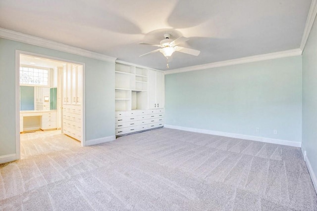 unfurnished bedroom featuring baseboards, light carpet, and ornamental molding