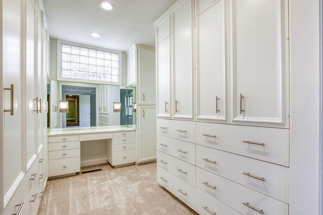 walk in closet featuring visible vents and light colored carpet