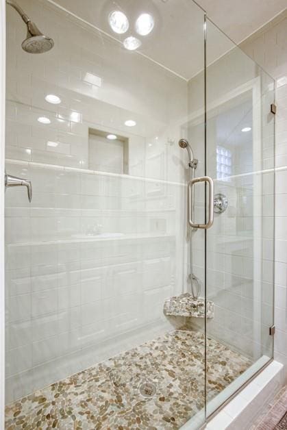 full bathroom with a shower stall