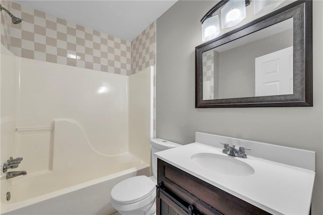 bathroom with vanity, bathing tub / shower combination, and toilet