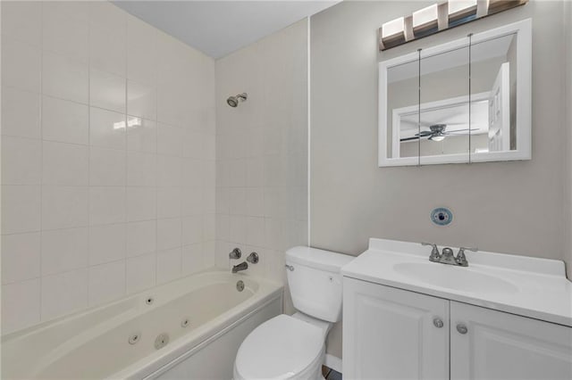 full bath with toilet, ceiling fan, vanity, and a combined bath / shower with jetted tub