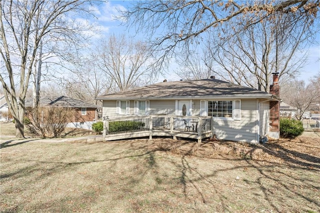 back of property with a wooden deck