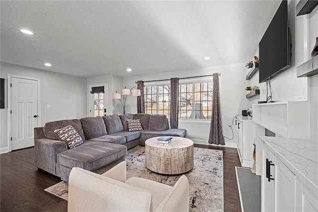 living area with dark wood finished floors, recessed lighting, and baseboards