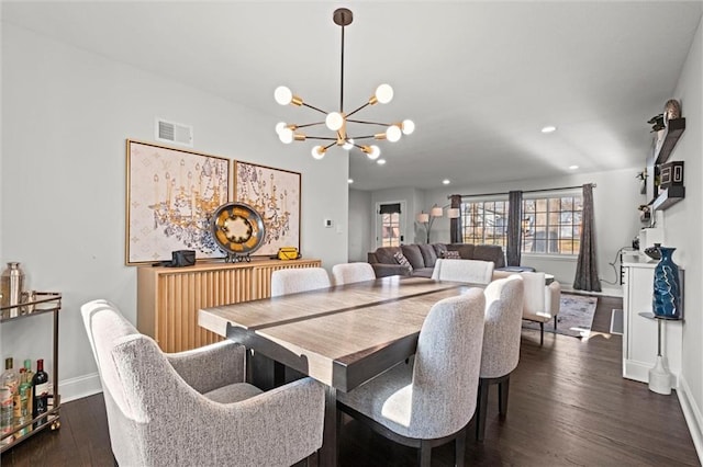 dining room featuring baseboards, visible vents, recessed lighting, dark wood-type flooring, and a notable chandelier