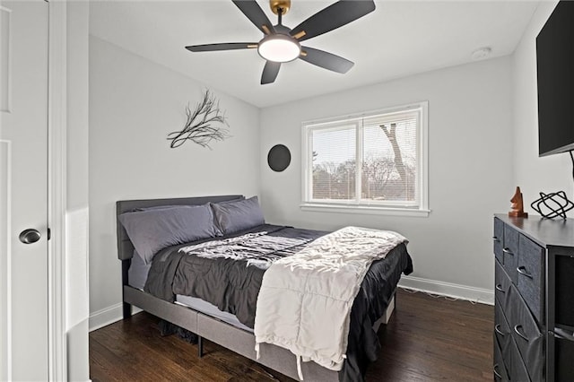 bedroom with baseboards, dark wood-style floors, and a ceiling fan