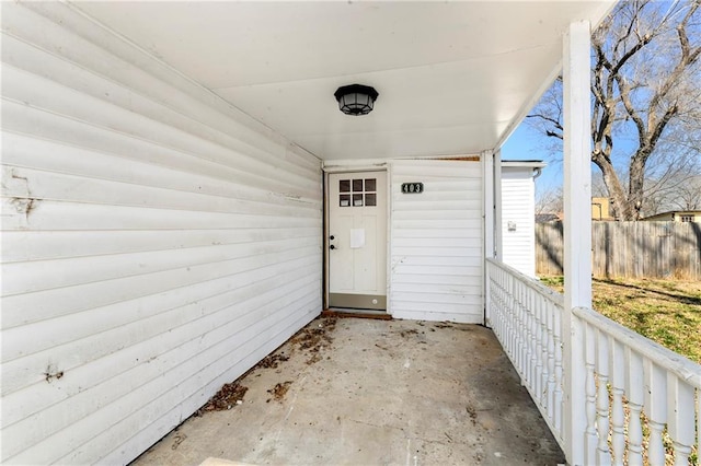 doorway to property with fence