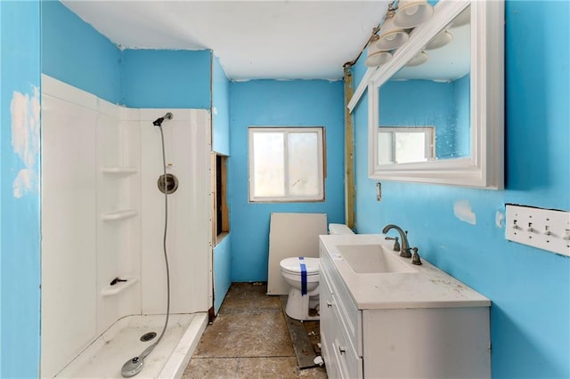 full bath featuring a shower, toilet, and vanity