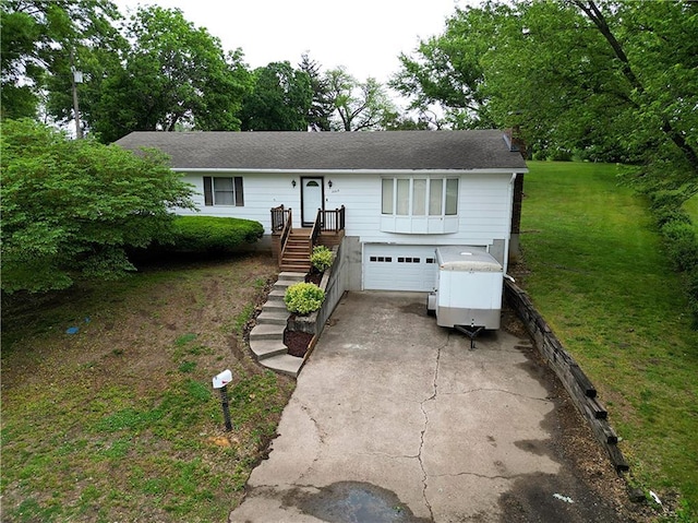 2213 Millwood Dr, Atchison, KS 66002 - ranch-style home featuring an attached garage, driveway, and a front lawn